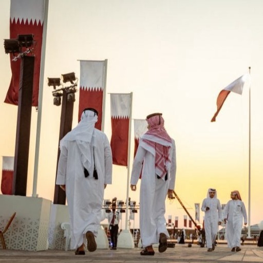 Cultural installations, night lights, visitor crowds, stage